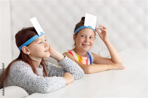 brain games card on forehead.